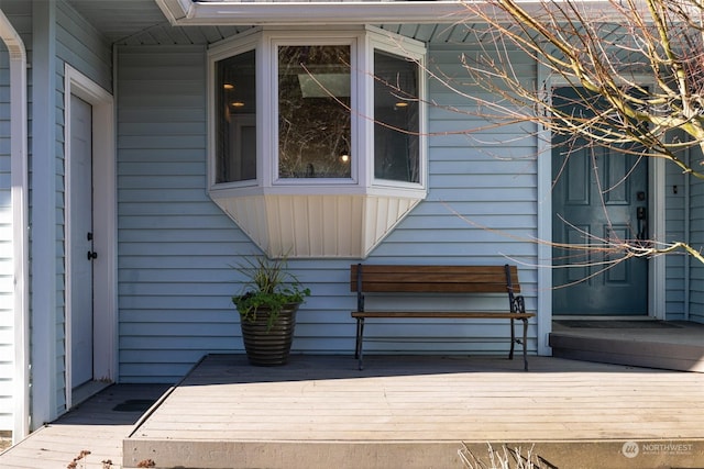 view of property exterior featuring a wooden deck