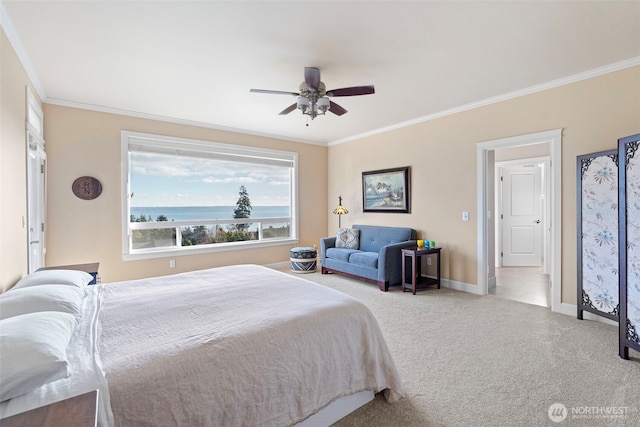 bedroom with a water view, baseboards, ornamental molding, and carpet flooring