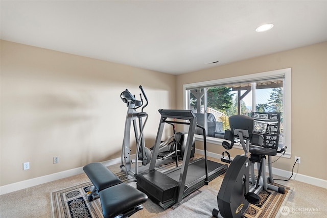 exercise area with recessed lighting, visible vents, baseboards, and light colored carpet