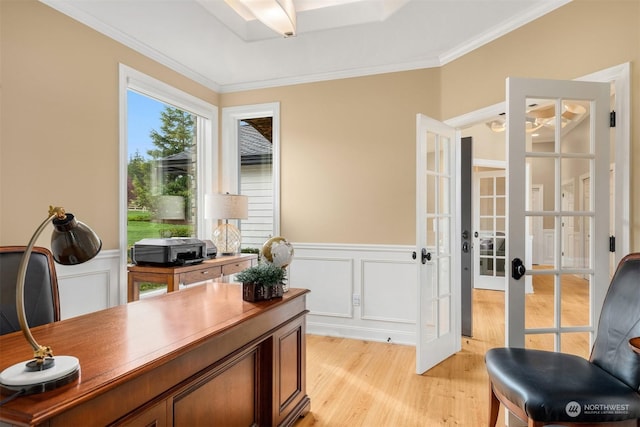 office area featuring french doors, ornamental molding, and light hardwood / wood-style flooring