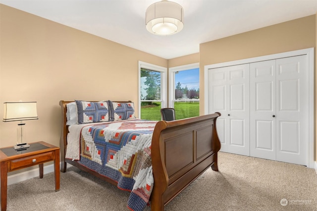 carpeted bedroom with a closet