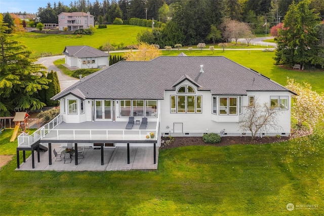 back of property with a yard, a patio, and a deck