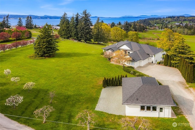 birds eye view of property with a mountain view