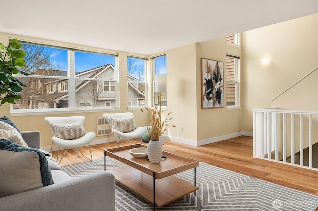 living room featuring baseboards and wood finished floors