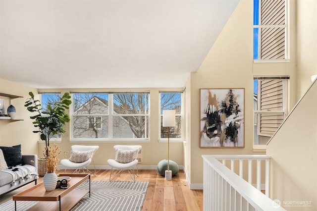 interior space with wood finished floors and baseboards