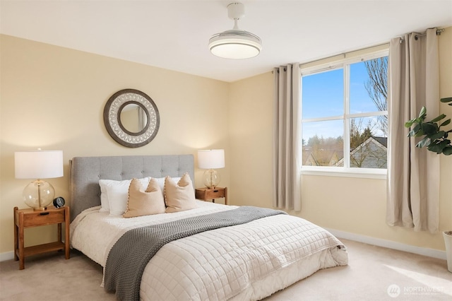 carpeted bedroom with baseboards