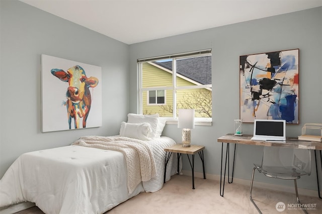 carpeted bedroom featuring baseboards