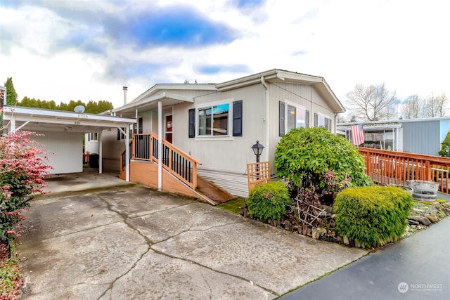 view of front of home with a carport