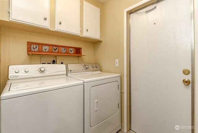 washroom with cabinets and independent washer and dryer