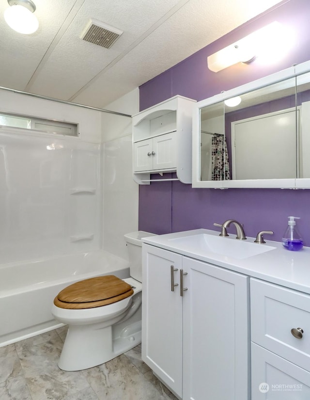 full bathroom with vanity, shower / bathtub combination with curtain, and toilet