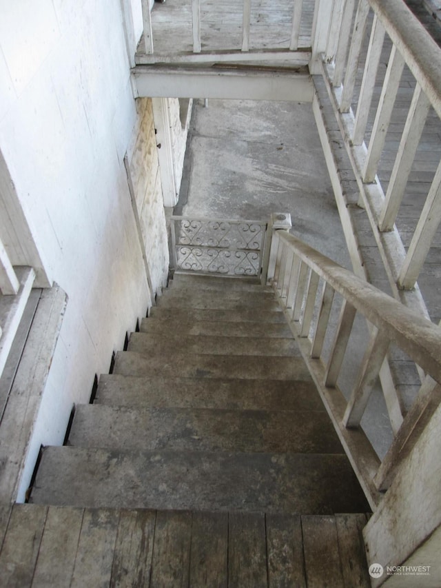 stairs with hardwood / wood-style floors