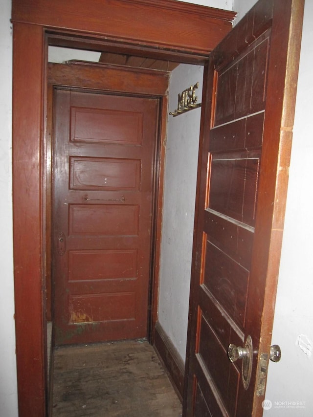 corridor with dark hardwood / wood-style floors