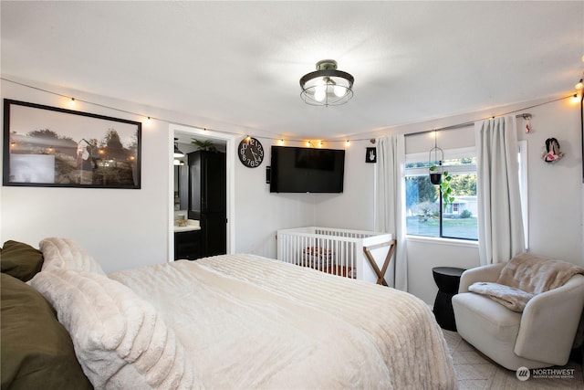 bedroom featuring ensuite bath