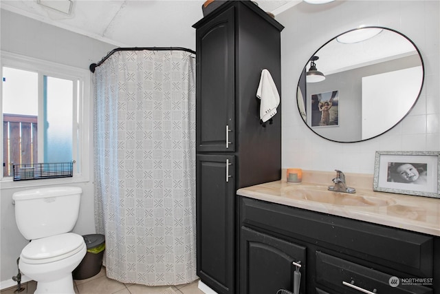 bathroom featuring tile patterned flooring, vanity, a shower with curtain, and toilet