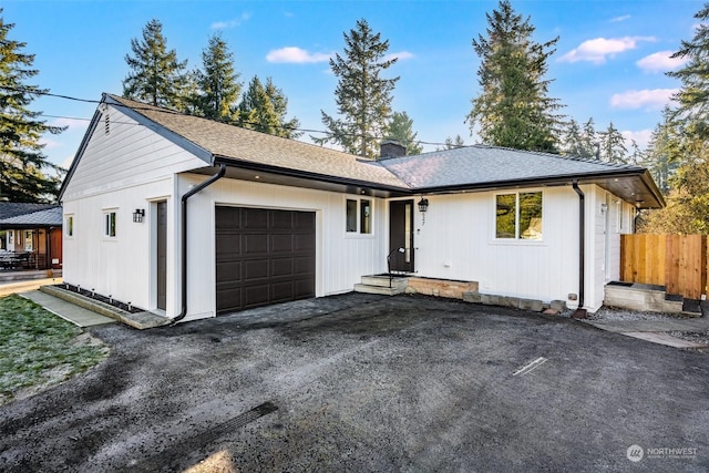 single story home featuring a garage