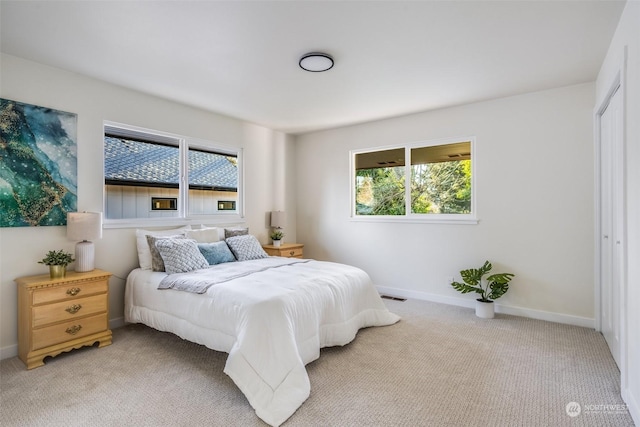 bedroom with light colored carpet