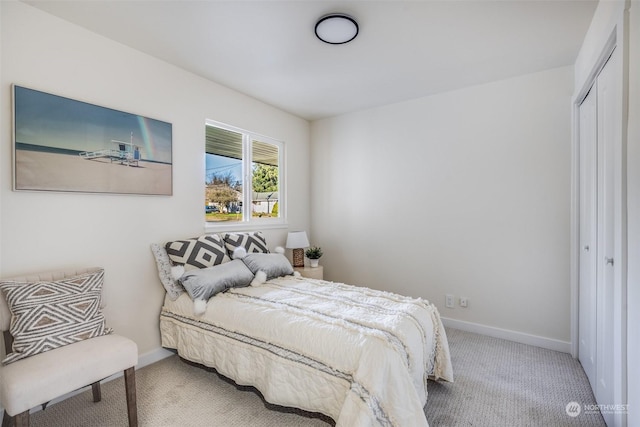 carpeted bedroom featuring a closet