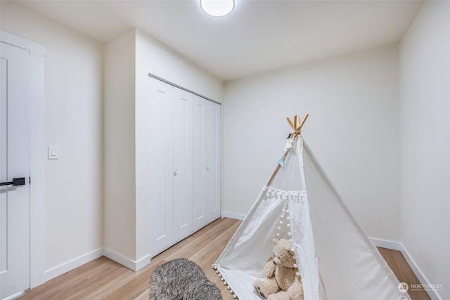 recreation room with light hardwood / wood-style floors