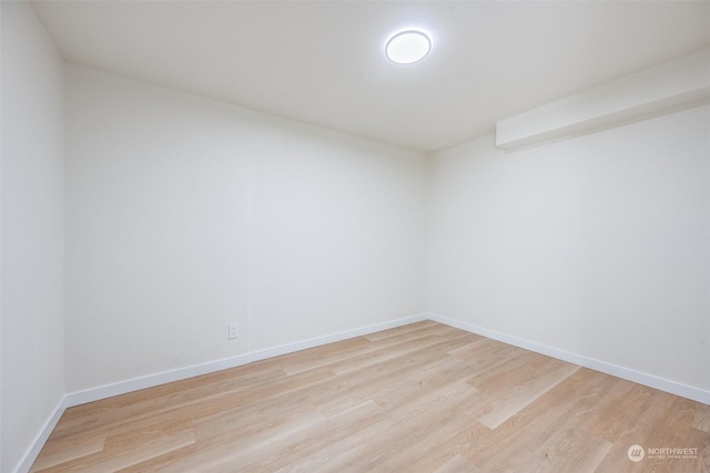 unfurnished room with light wood-type flooring