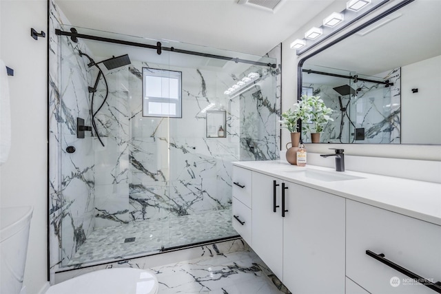 bathroom with vanity, walk in shower, and toilet