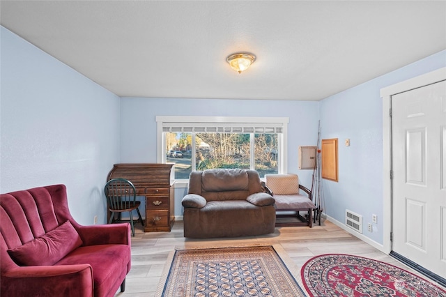 living area with light hardwood / wood-style floors