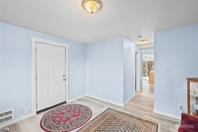 foyer with light wood-type flooring