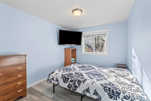 bedroom with light hardwood / wood-style floors