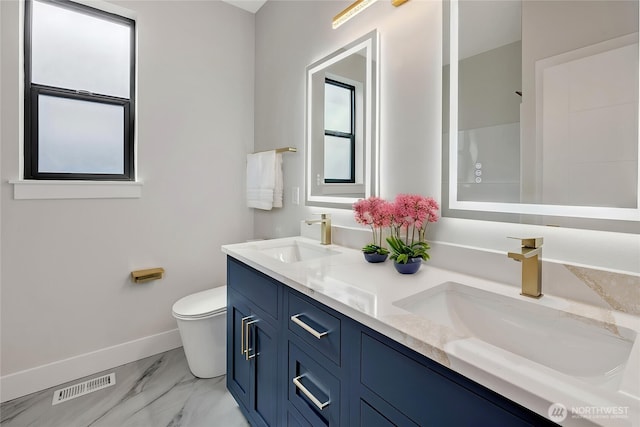 21402 E 39th Dr SE Unit A, Bothell, WA 98021 - bathroom featuring baseboards, toilet, marble finish floors, and double vanity