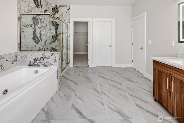 21402 39th Dr SE Unit A, Bothell, WA 98021 - bathroom featuring a stall shower, a garden tub, vanity, marble finish flooring, and baseboards