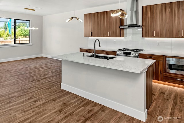 21402 39th Dr SE Unit A, Bothell, WA 98021 - kitchen with wall chimney range hood, a sink, appliances with stainless steel finishes, dark wood finished floors, and baseboards
