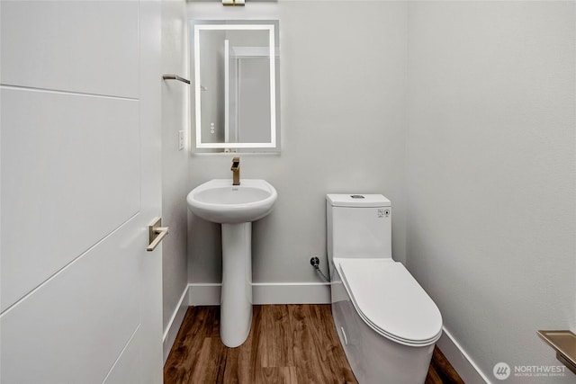 21402 39th Dr SE Unit A, Bothell, WA 98021 - bathroom with baseboards, wood finished floors, and toilet
