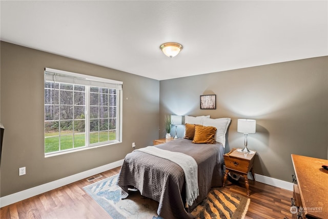 bedroom with wood-type flooring