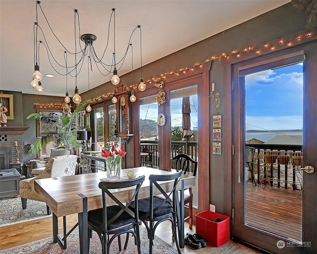 dining area with an inviting chandelier and wood-type flooring