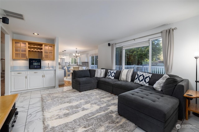 living room featuring an inviting chandelier