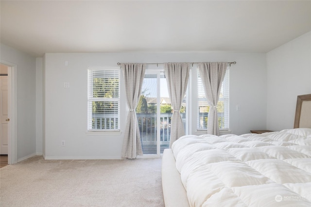 carpeted bedroom featuring access to outside