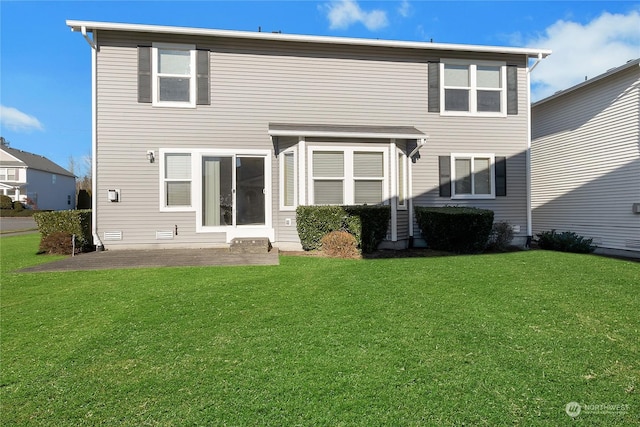 rear view of property with a yard