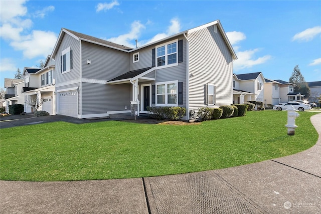 view of front of property with a garage, aphalt driveway, a front lawn, and a residential view