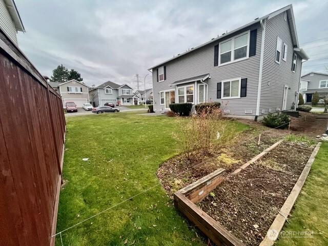 exterior space with a garden and a residential view