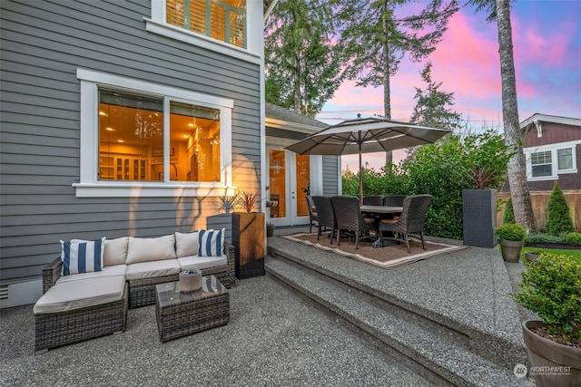 patio terrace at dusk with outdoor lounge area