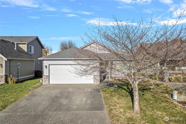 view of front of property with a garage and a front yard