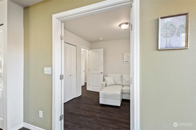 corridor featuring dark wood-type flooring