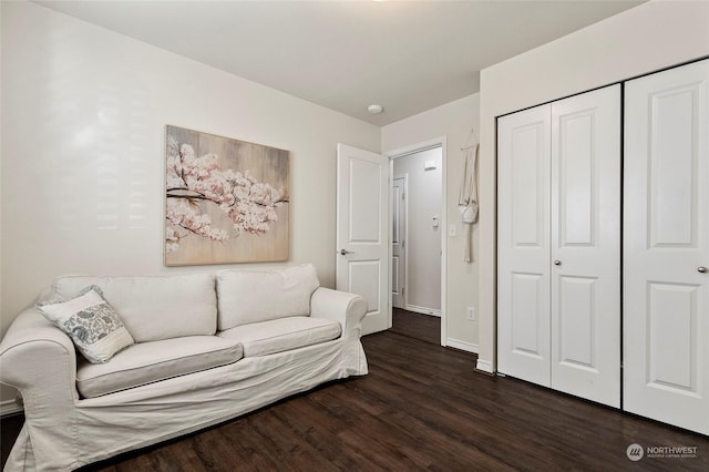 living area with dark hardwood / wood-style floors