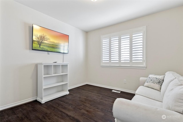 living room featuring dark wood-type flooring