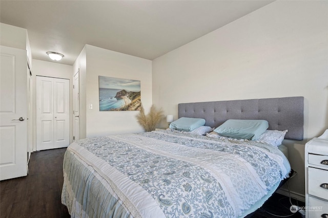 bedroom with dark hardwood / wood-style flooring