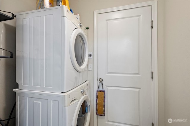 laundry area with stacked washer / dryer