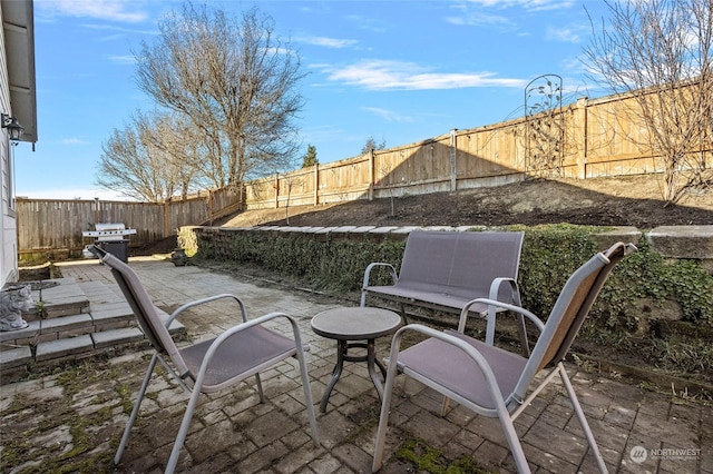 view of patio with a grill