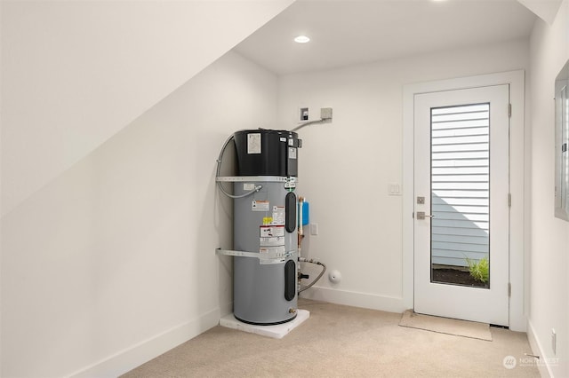 utility room featuring heat pump water heater