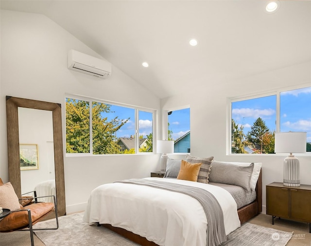 bedroom with lofted ceiling and a wall unit AC