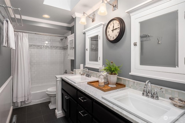 full bathroom featuring tile patterned floors, toilet, crown molding, vanity, and shower / bath combo