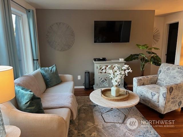 living room with hardwood / wood-style flooring and a wealth of natural light